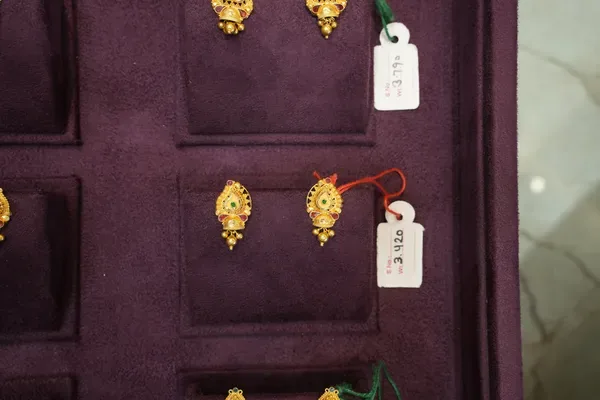 Ruby Accented Gold Studs — Siddhivinayak Jewellers
